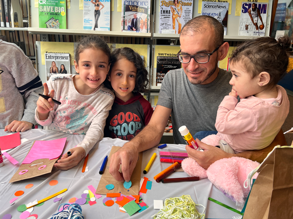 Family enjoying Alma Powell library - Kalamazoo Public Library